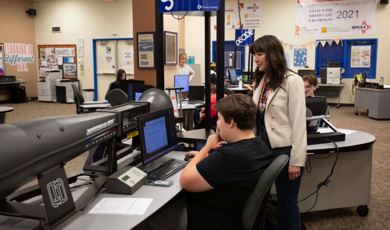 Students collaborate with teachers in the Smart Lab, applying STEM skills to real-world challenges in a supportive learning environment.