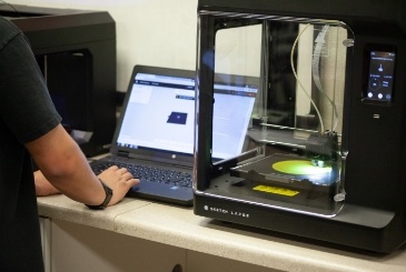 professional-certifications-365x245 A student operates a 3D printer during a certification course.