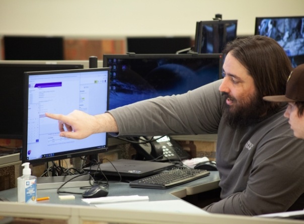 Northpoint Charter science teacher Mathias Sagartz provides one-on-one instruction in the tech-based main lab.