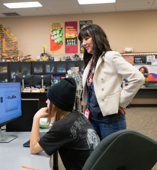 Denise Dixson of Northpoint Charter School provides personalized instruction to a student working on a computer.