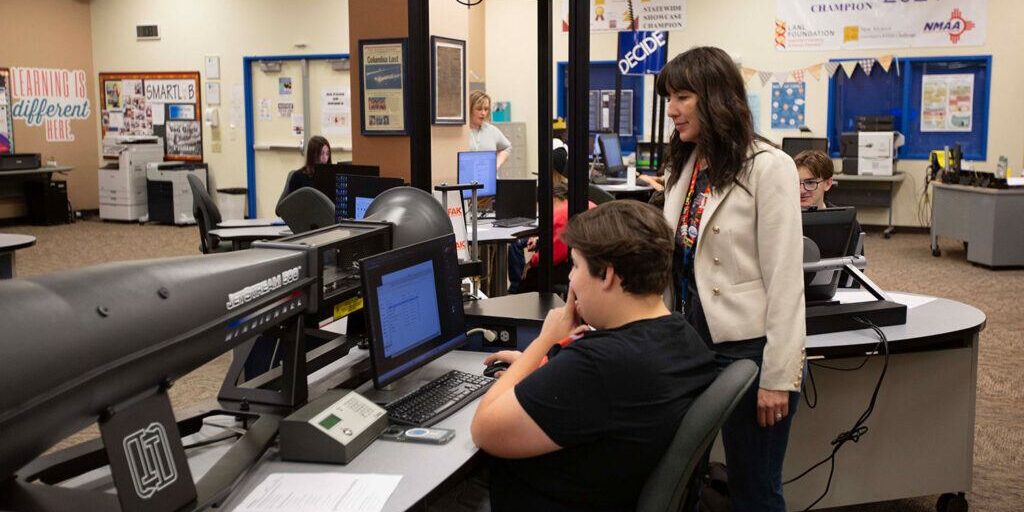 Students collaborate with teachers in the Smart Lab, applying STEM skills to real-world challenges in a supportive learning environment.